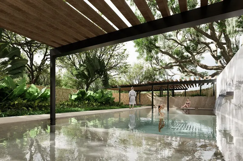 Alberca del Wellness Club bajo una pérgola